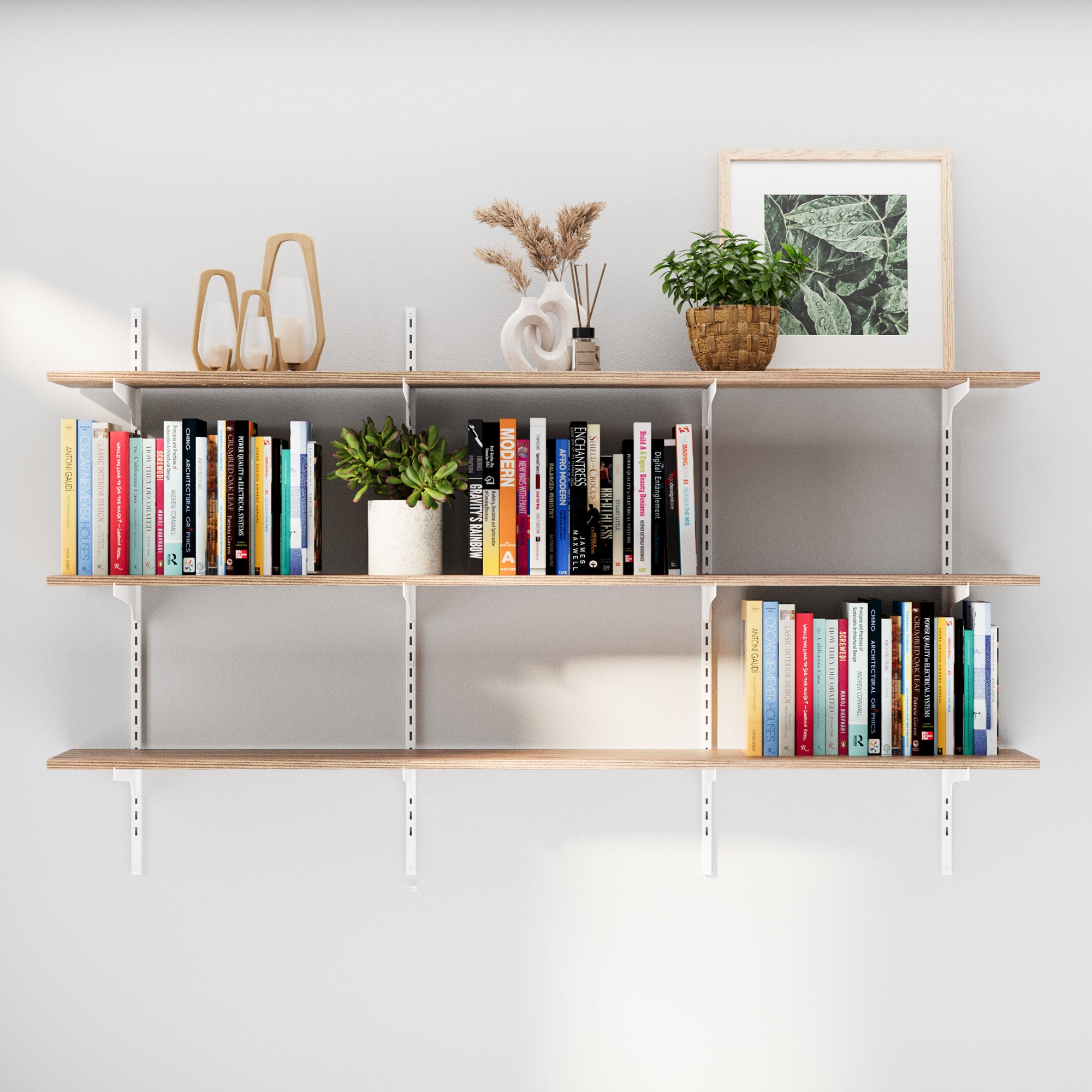 The 4-tier 60"  wall-mounted shelf system with white adjustable brackets styled in a living room. Showcases adjustable shelving with white brackets and wood-finish boards, holding books, plants, and décor.