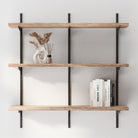 3 Tier boho shelves with books and decorative items against a white wall