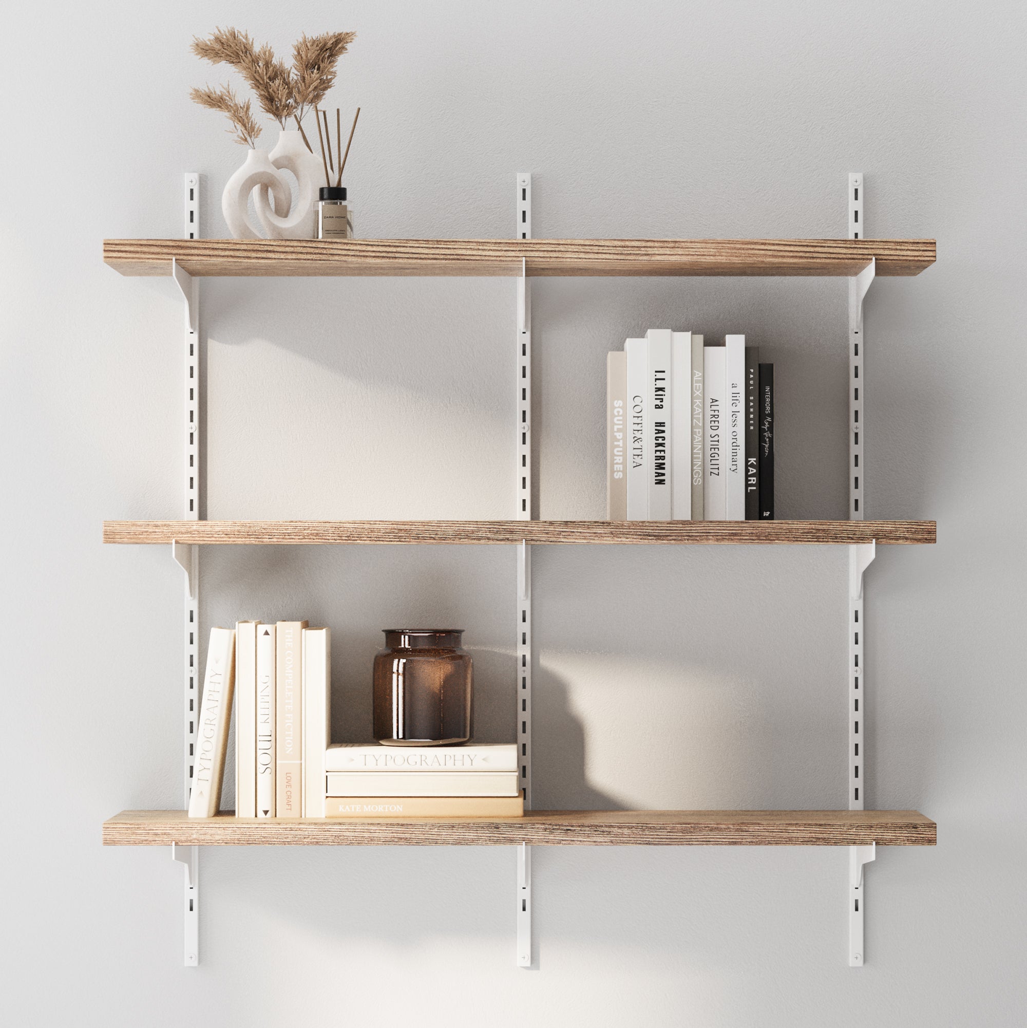 2 tier hanging shelves with adjustable white brackets with books and decorative items against a white wall