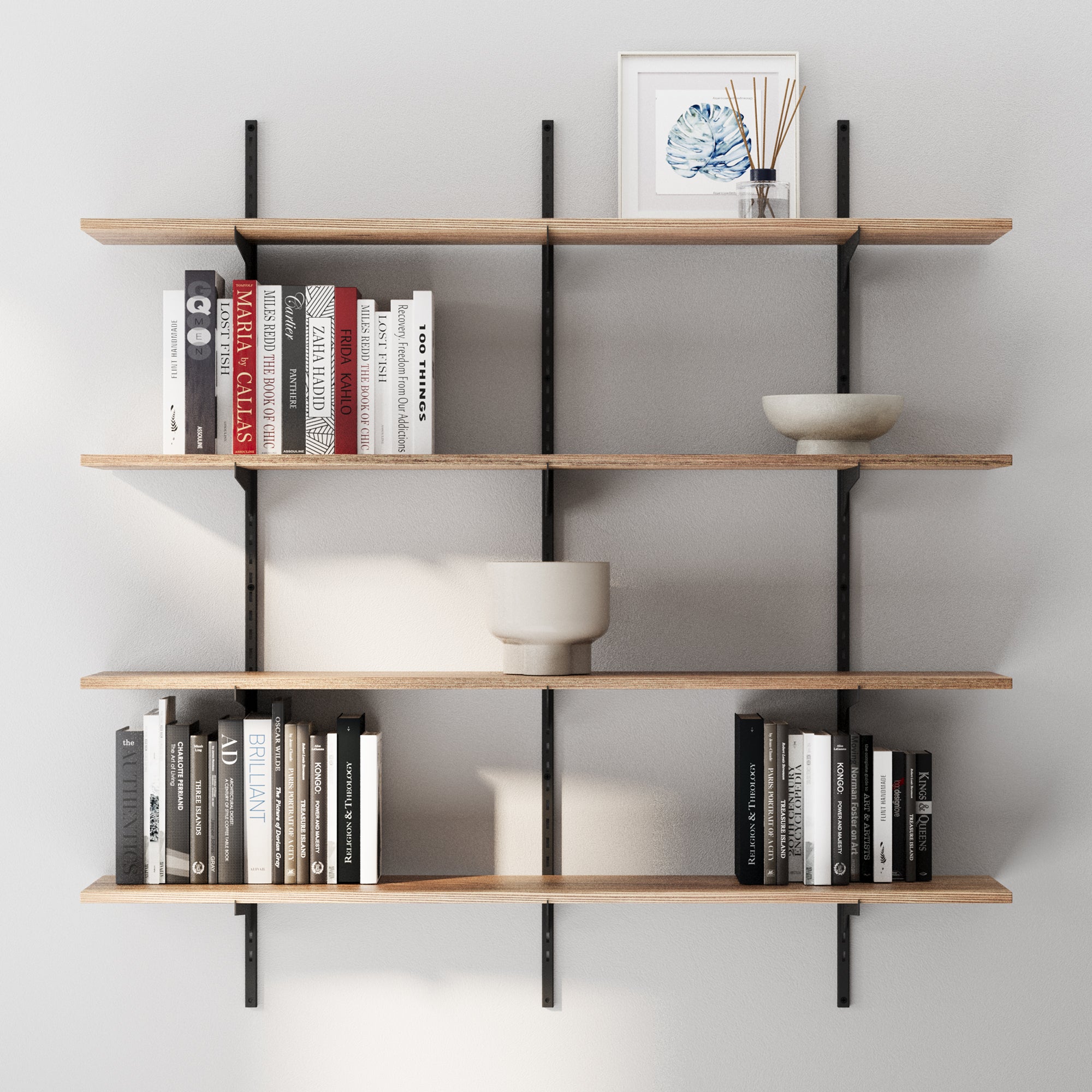 4 tiered hanging shelves with books and decorative items against a gray wall