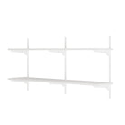 White wall-mounted shelving unit on a white background