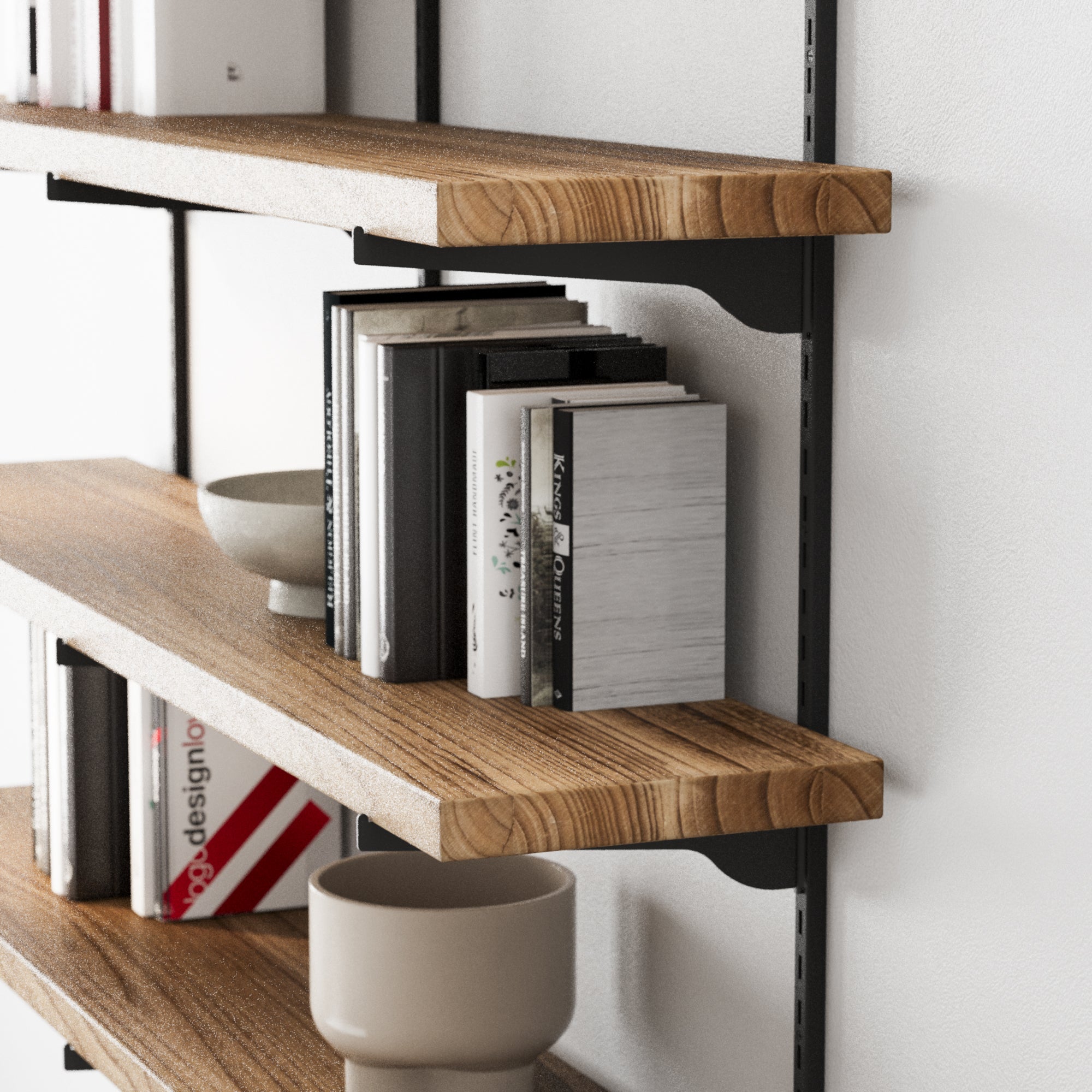 Wall bookshelf with books and decorative items against a white wall
