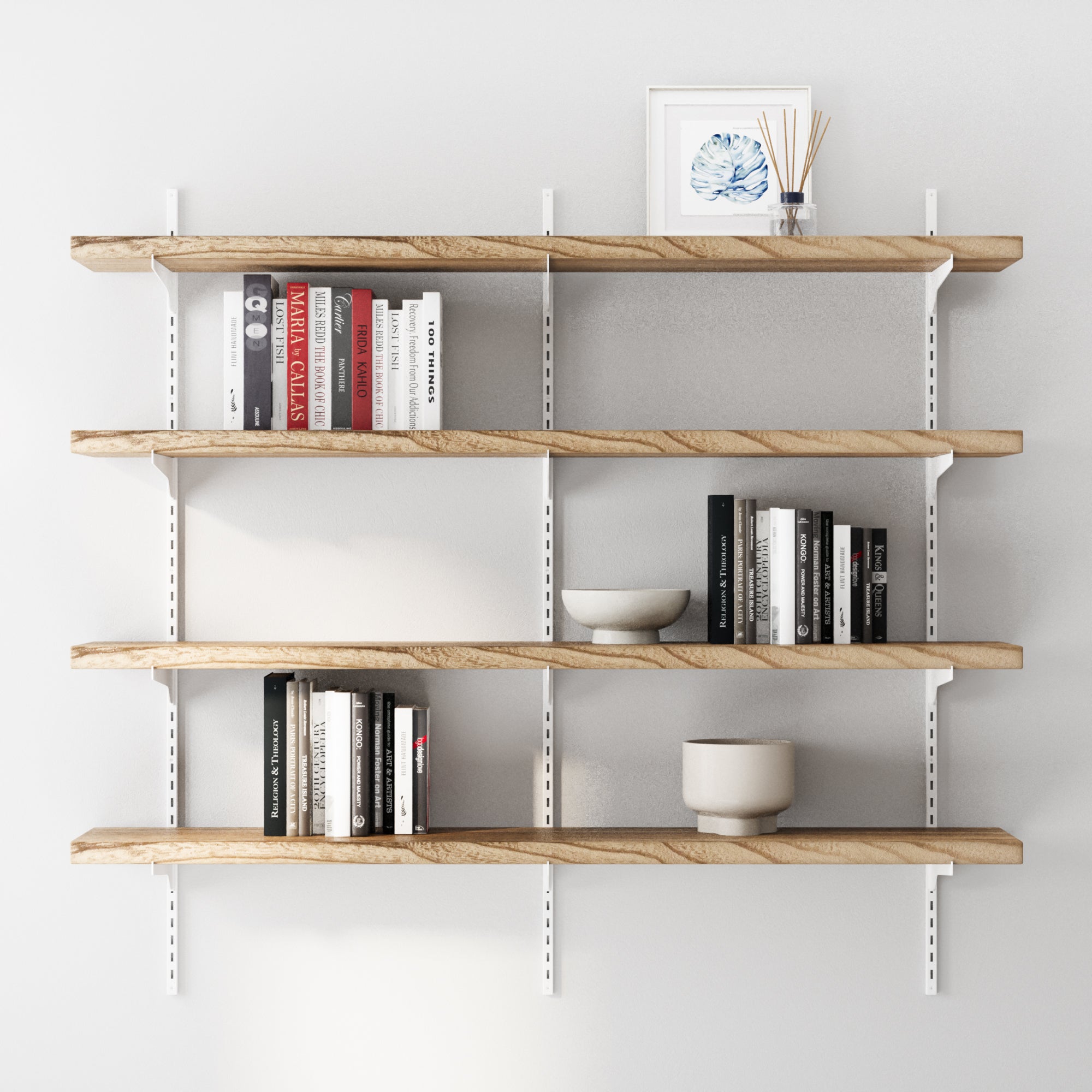 4 tier decorative shelves with books and decor items against a white wall