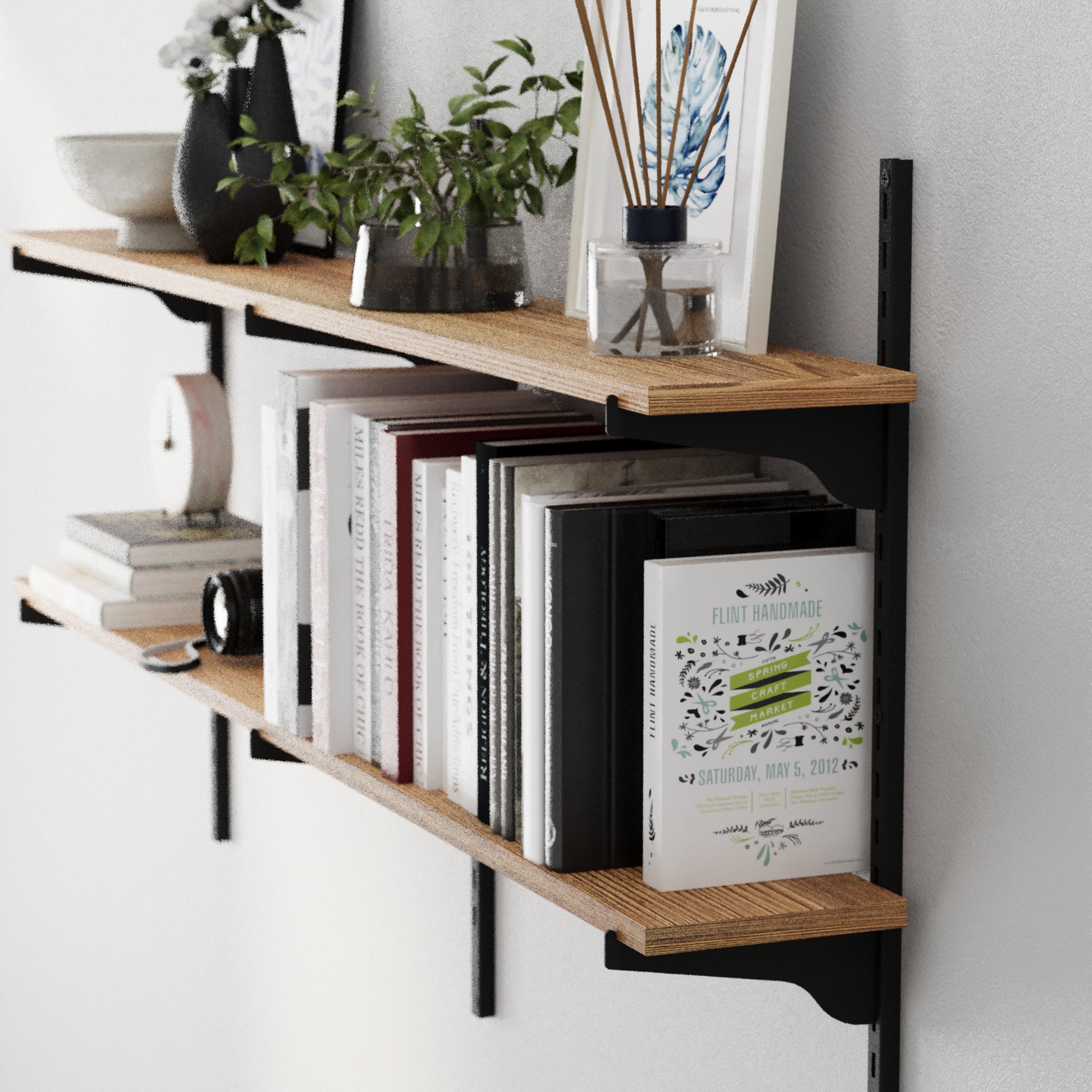 Wooden shelf with books and decorative items against a white wall