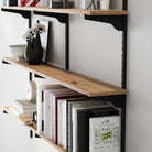 Wooden shelf with books and decorative items against a white wall