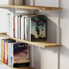 Wall shelf with books, including a prominent one titled 'Seasons Change' by Anthony Nardi.