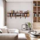 Modern living room decor with a farmhouse setup adjustable bookshelf, sofa, and coffee table.