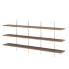 Set of three floating long shelves with metal brackets on a white background