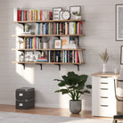 Floating ookshelf with books and decor items in a home office setting
