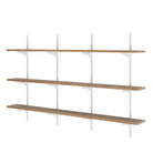 Three tiered hanging shelf with white metal brackets on a white background