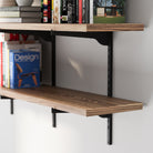 A rich wood grain board and black metal bracket, showing the slim profile, sturdy support, and neatly arranged books.