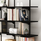 Multi tier black shelf and bracket system, showcasing smooth matte finish, sturdy support arms, and neatly stacked books.