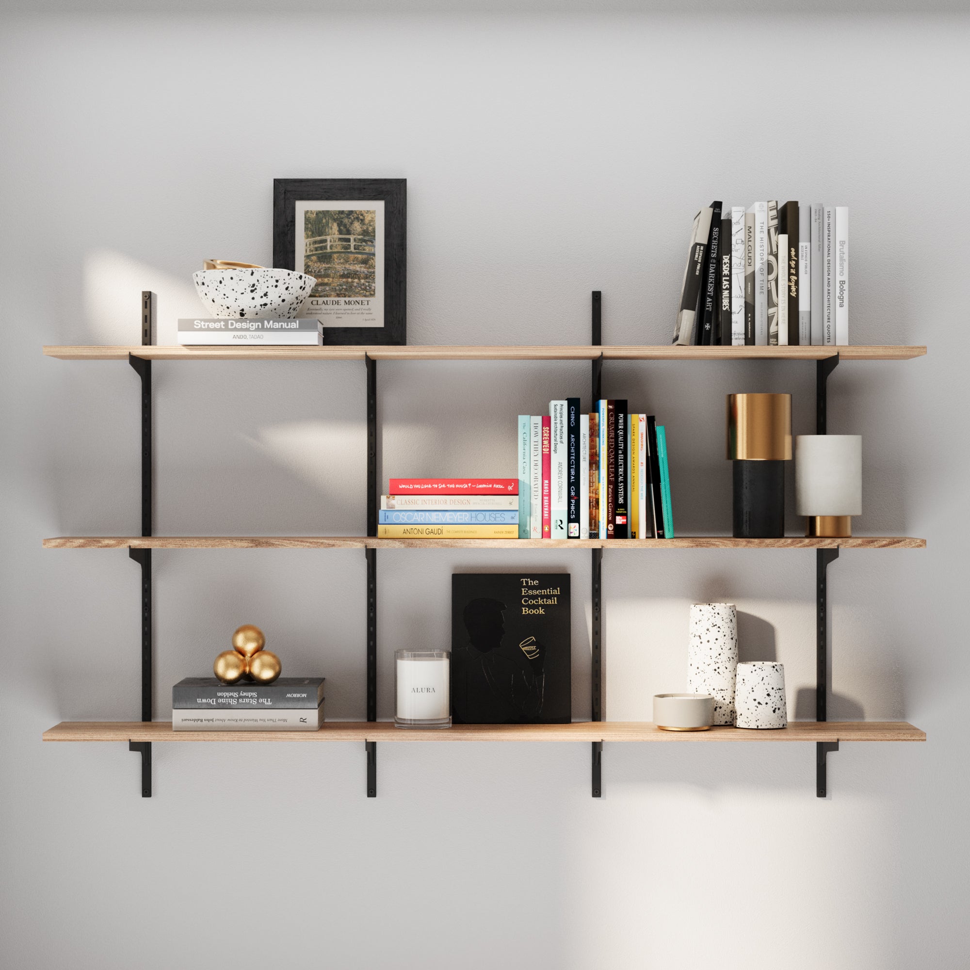 3 tier wood wall shelving unit with books and decor against a gray wall