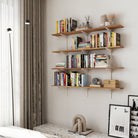 Modern living room setup featuring four-tier wall shelves filled with books and decor, mounted above a console, creating a warm, organized, and stylish interior look.