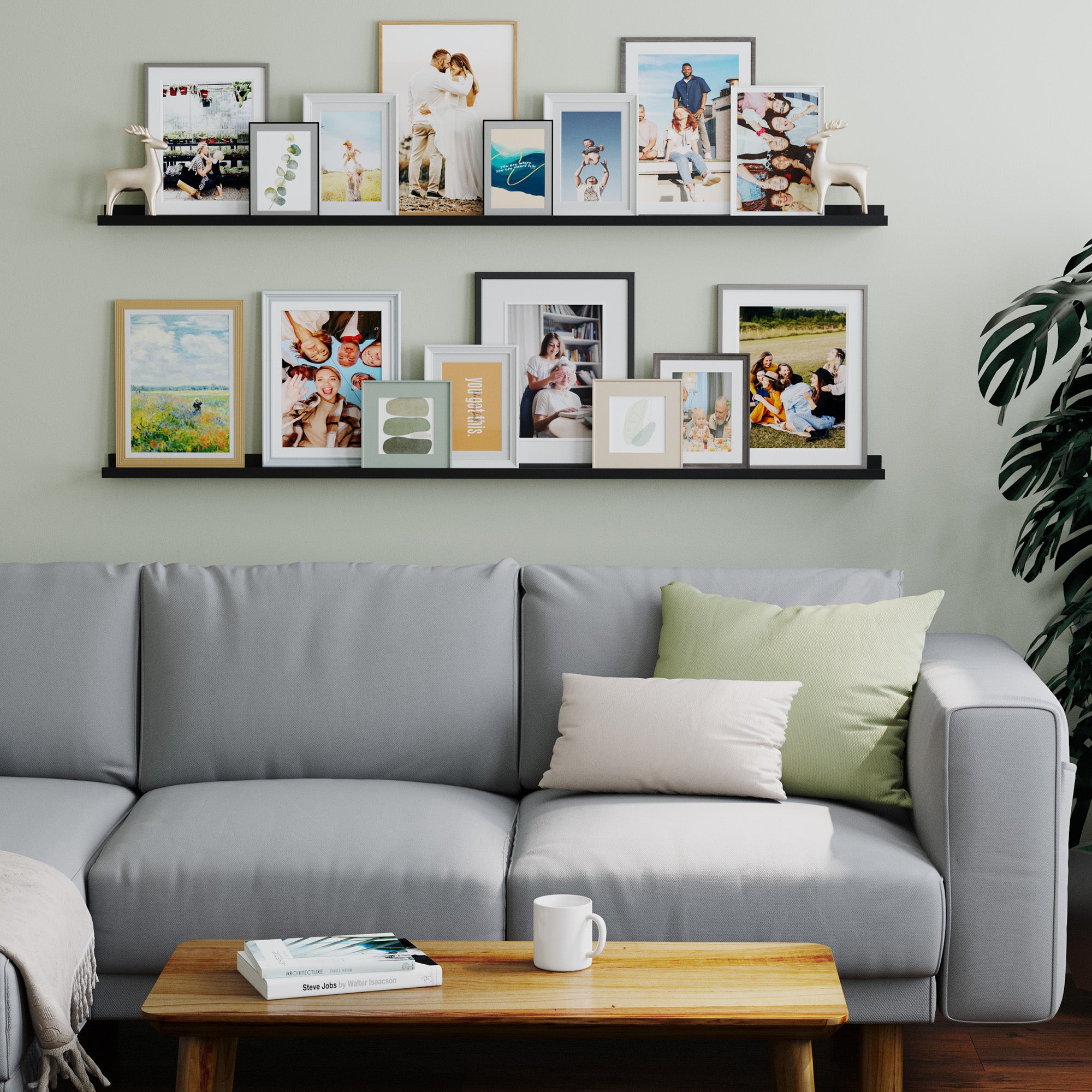 Living room with multiple photo frames on black shelves above a grey couch.